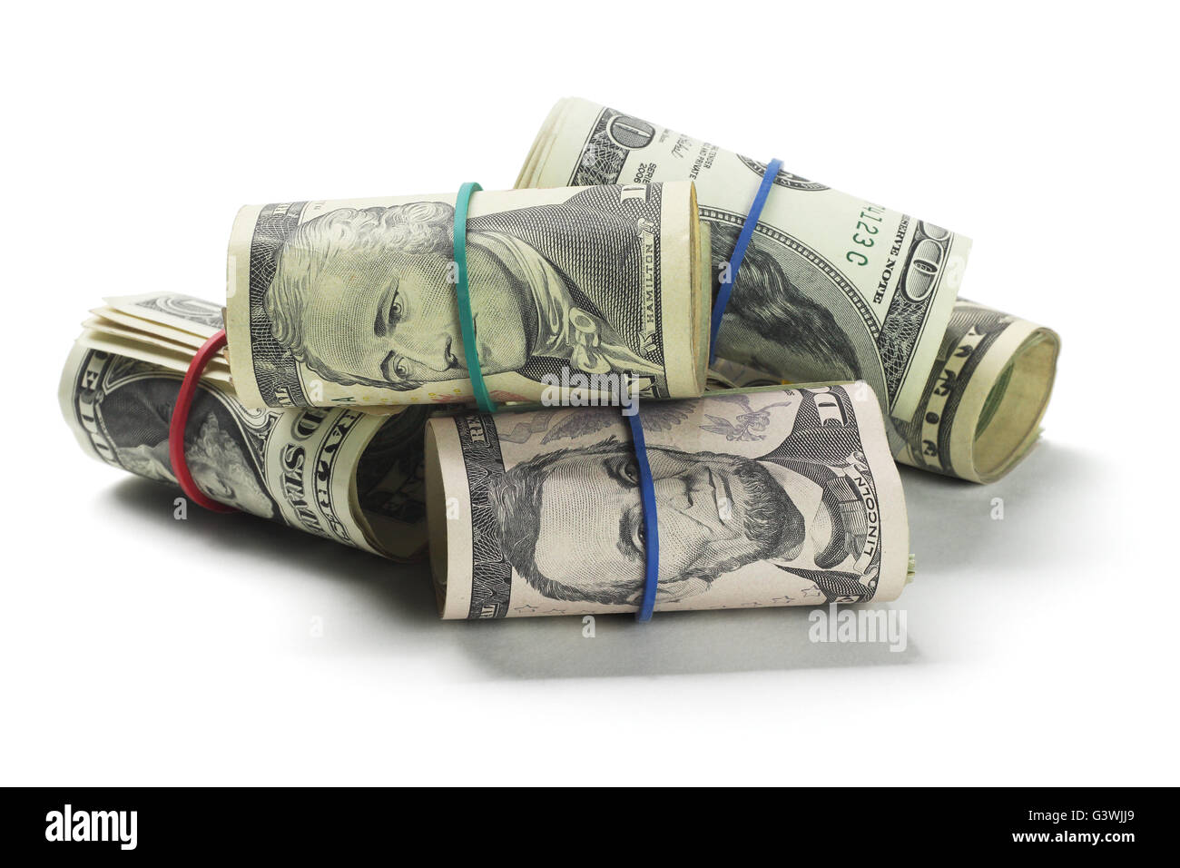 Rolls of US Dollars Lying on White Background Stock Photo