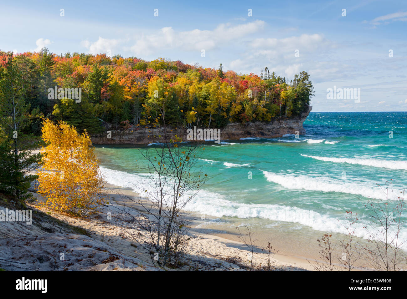 Autumn colors frame Chapel Beach at Pictured Rocks National Lakeshore along the coast of Lake Superior in Munising Michigan Stock Photo