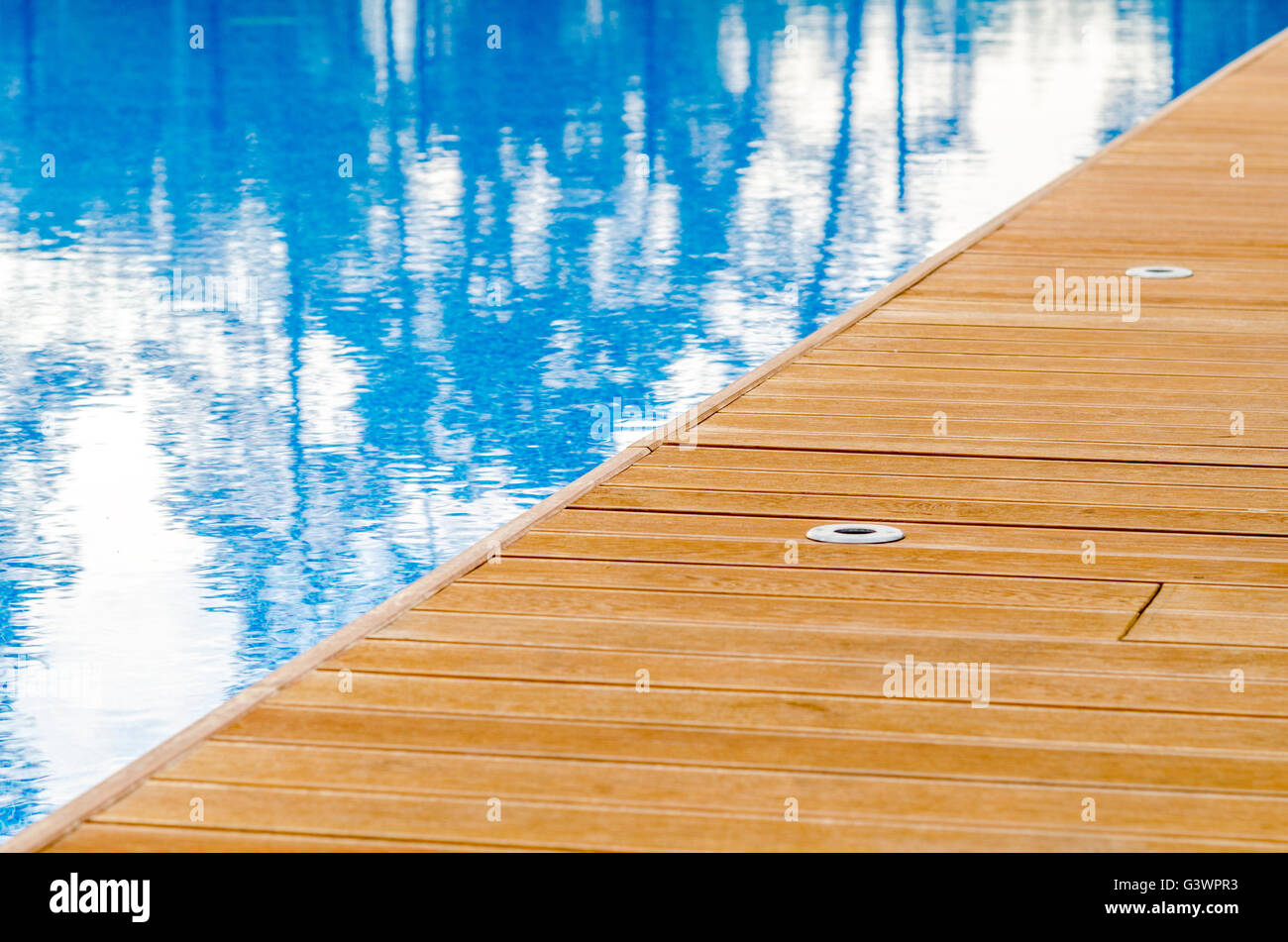 Swimming pool and wooden deck Stock Photo Alamy