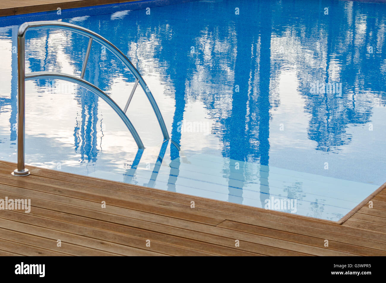 Swimming pool and wooden deck Stock Photo Alamy