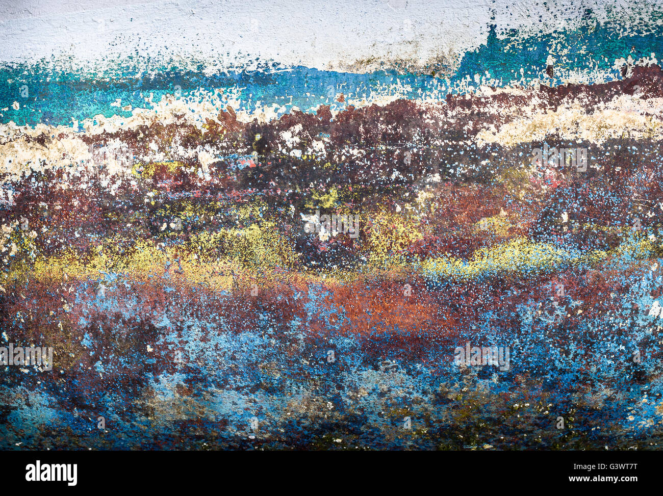 A surface rubbed down for painting revealing layers of old paint Stock