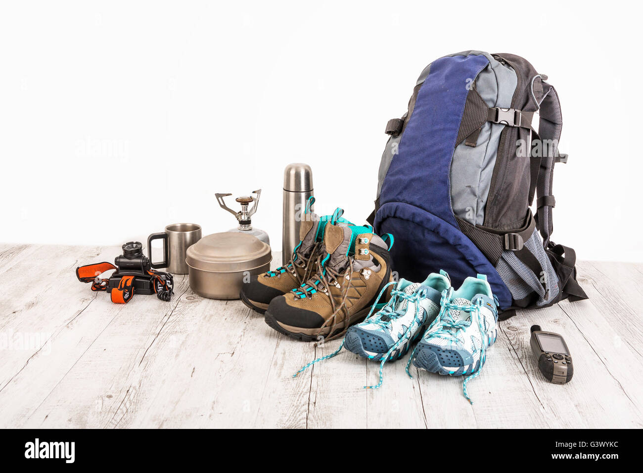 Outfit of traveler, climber, student, teenager. Overhead of essentials for modern sport young person. Different objects on white Stock Photo