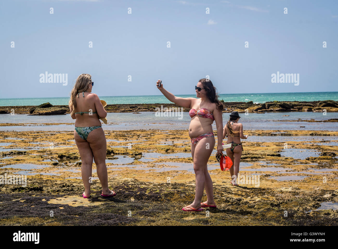 Woman taking selfies, Lagoon, Gunga Beach, Maceio, Alagoas, Brazil Stock Photo