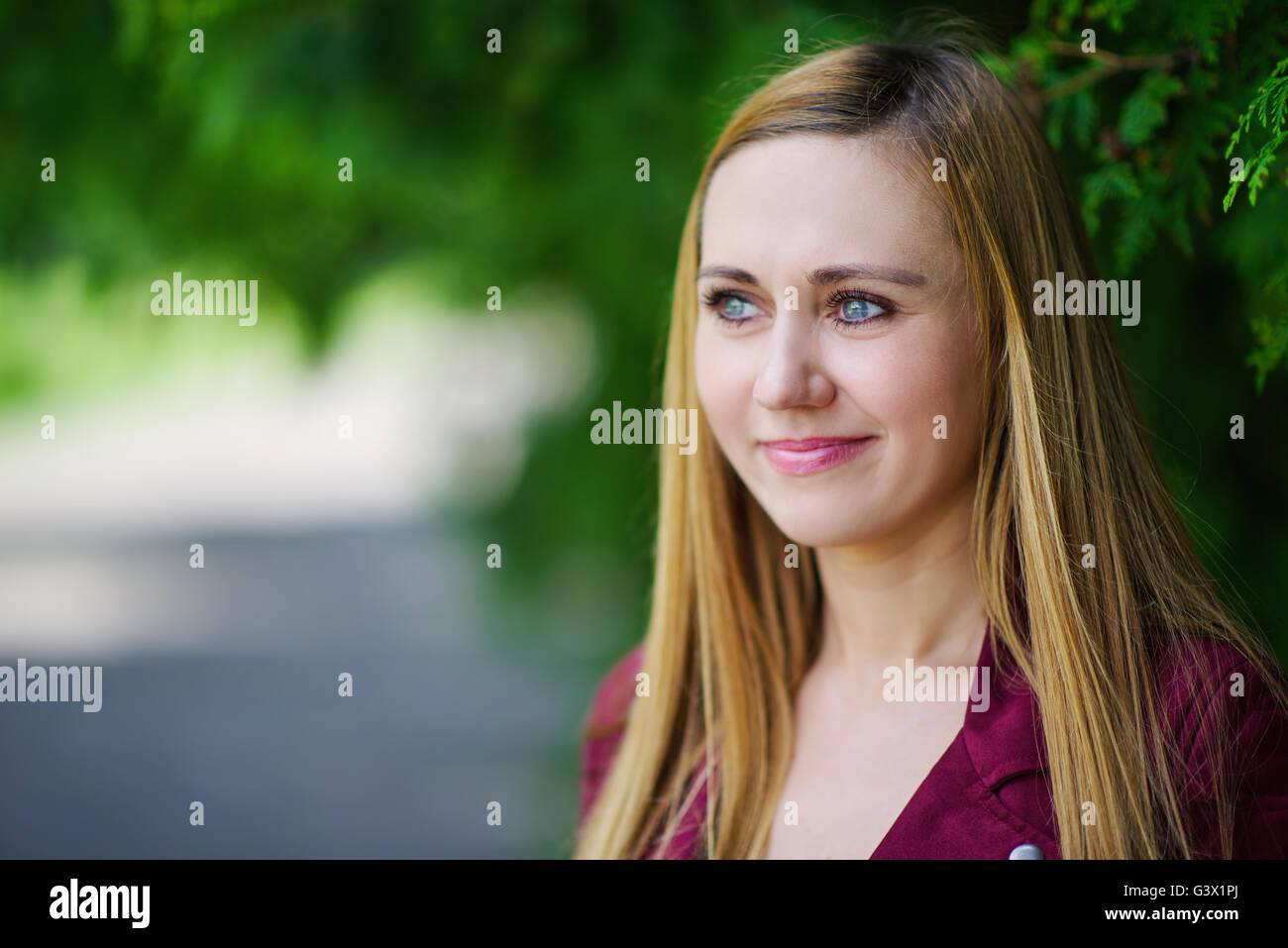 blonde girl on green background Stock Photo - Alamy