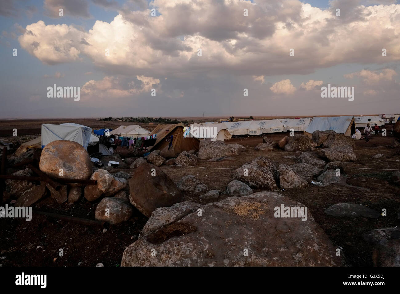 Temporary shelter tents in Nawroz refugee camp which was initially established to shelter Syrians displaced from the ongoing Syrian civil war then occupied by displaced people from the minority Yazidi sect, fleeing the violence in the Iraqi town of Sinjar situated next to the town of al-Malikyah in Rojava autonomous Kurdish region, North Eastern Syria. Stock Photo