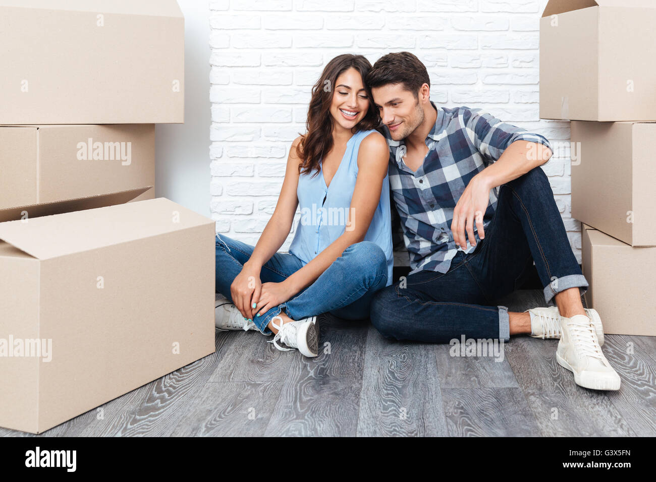 Young happy married couple moving into their new home Stock Photo - Alamy