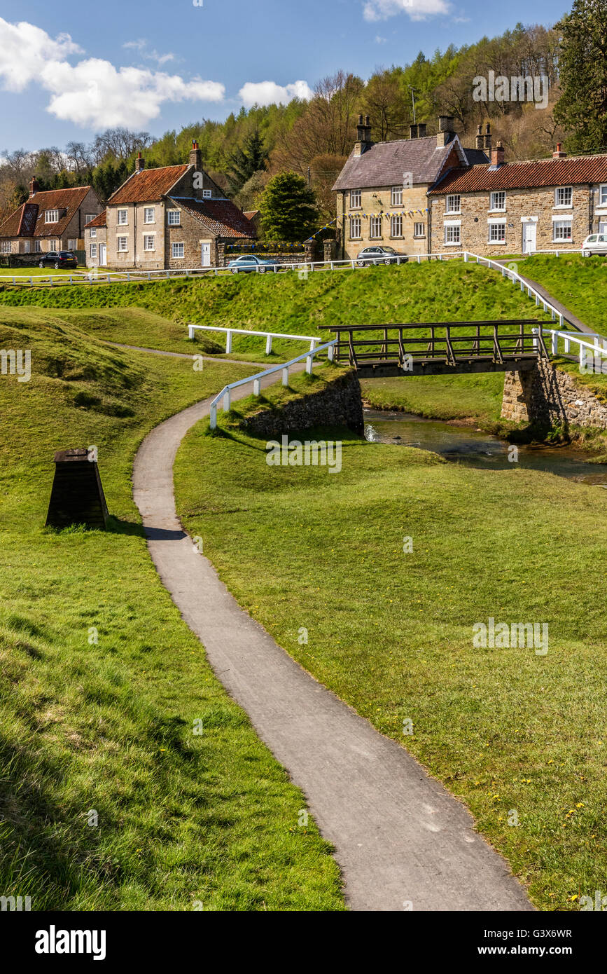 The path leading to a bridge over Hutton beck in Hutton le Hole village ...