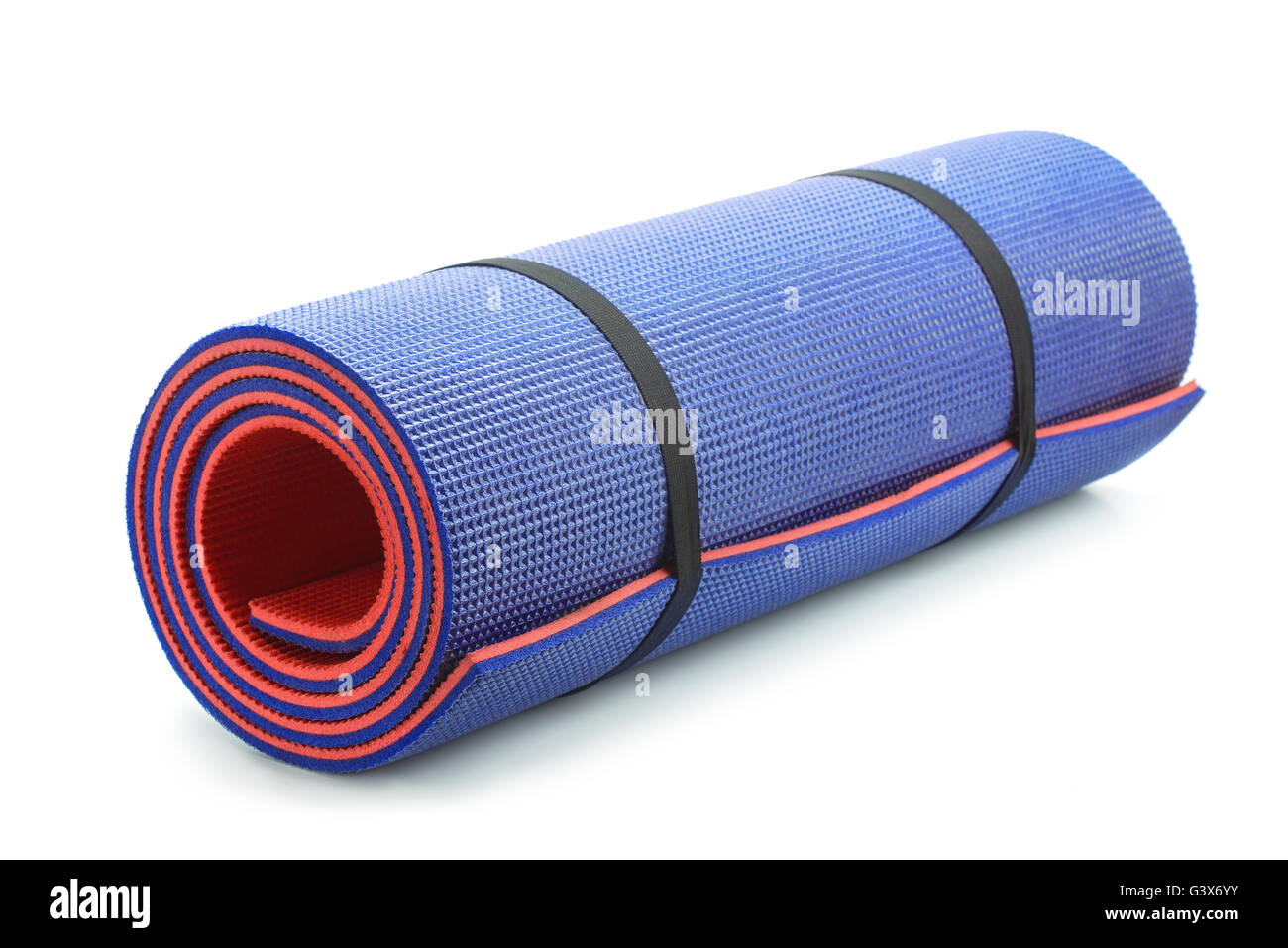 Rolled blue foam yoga mat isolated on white Stock Photo