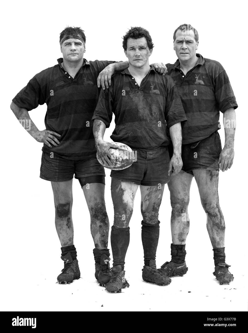 Portrait of muddy rugby players at the end of a game. Stock Photo