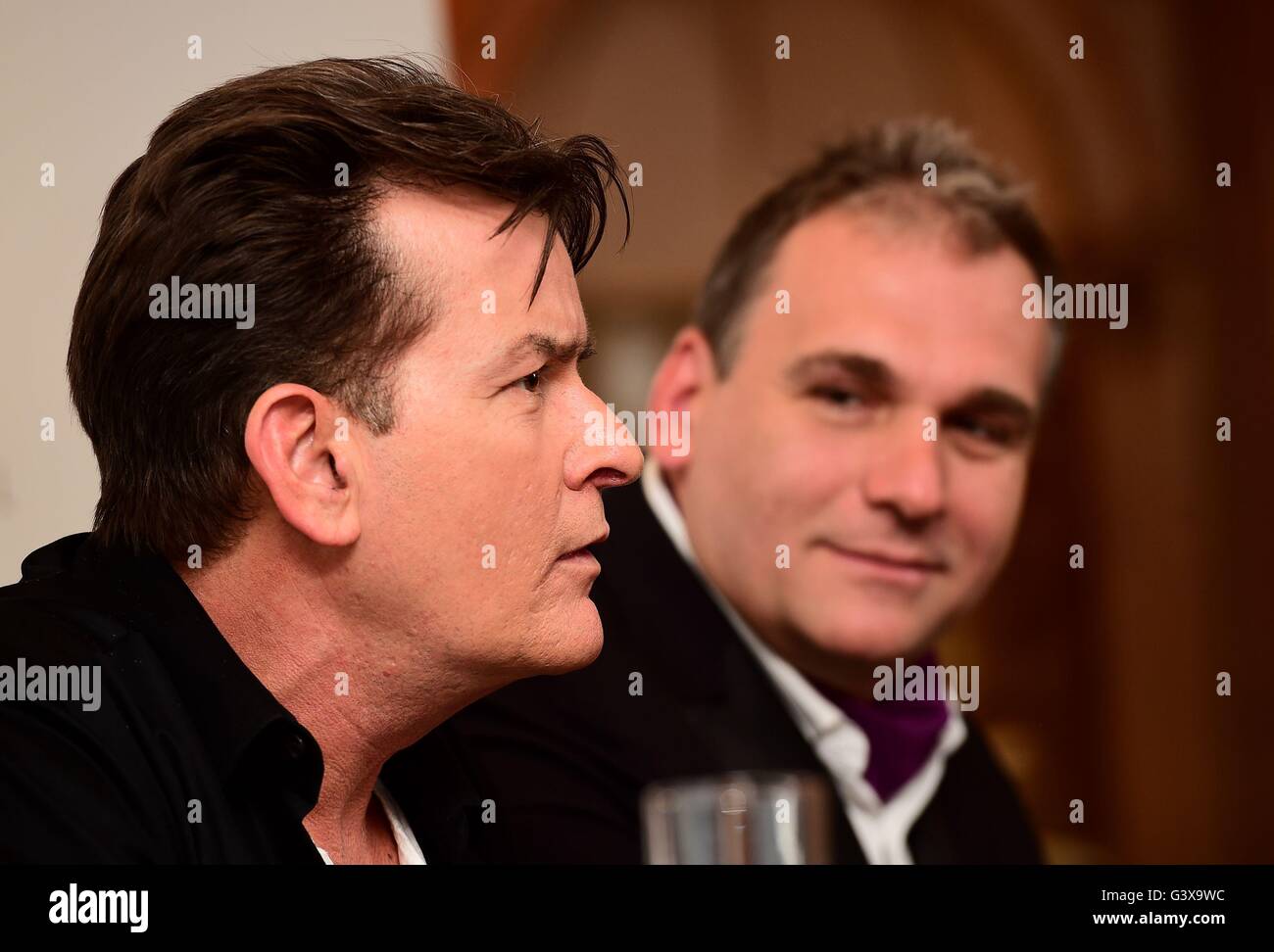Charlie Sheen and Filip Sedic at a press conference to endorse Lelo Hex condoms at the Westbury Hotel, London. Stock Photo