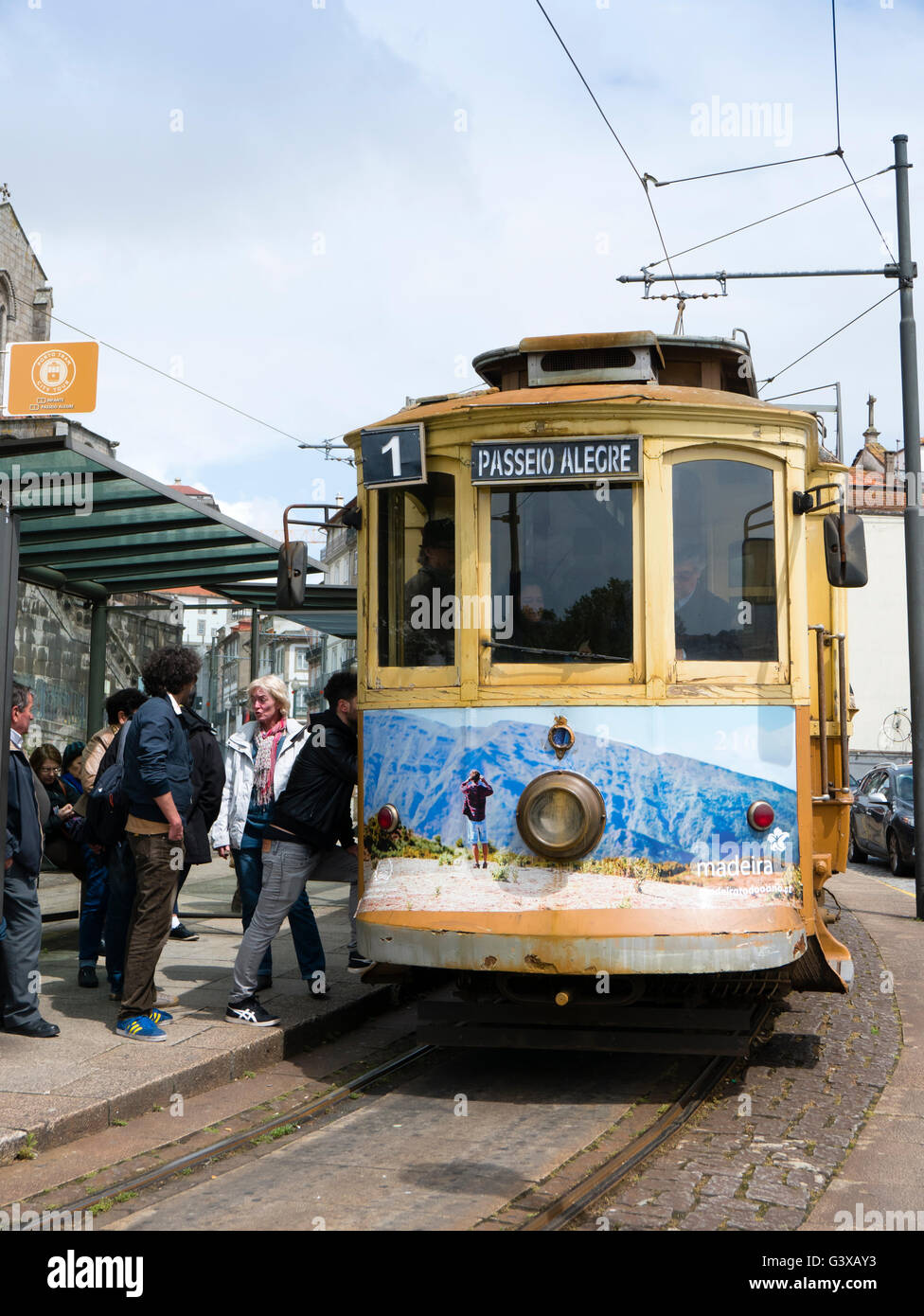 Passengers boarding a traditional tram, Porto, Portugal. Stock Photo