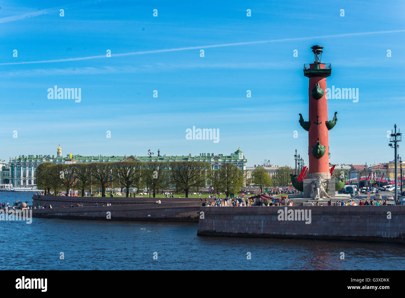 Rostral Column On Vasilievksy Island and Winter Palace behind, St. Petersburg Stock Photo