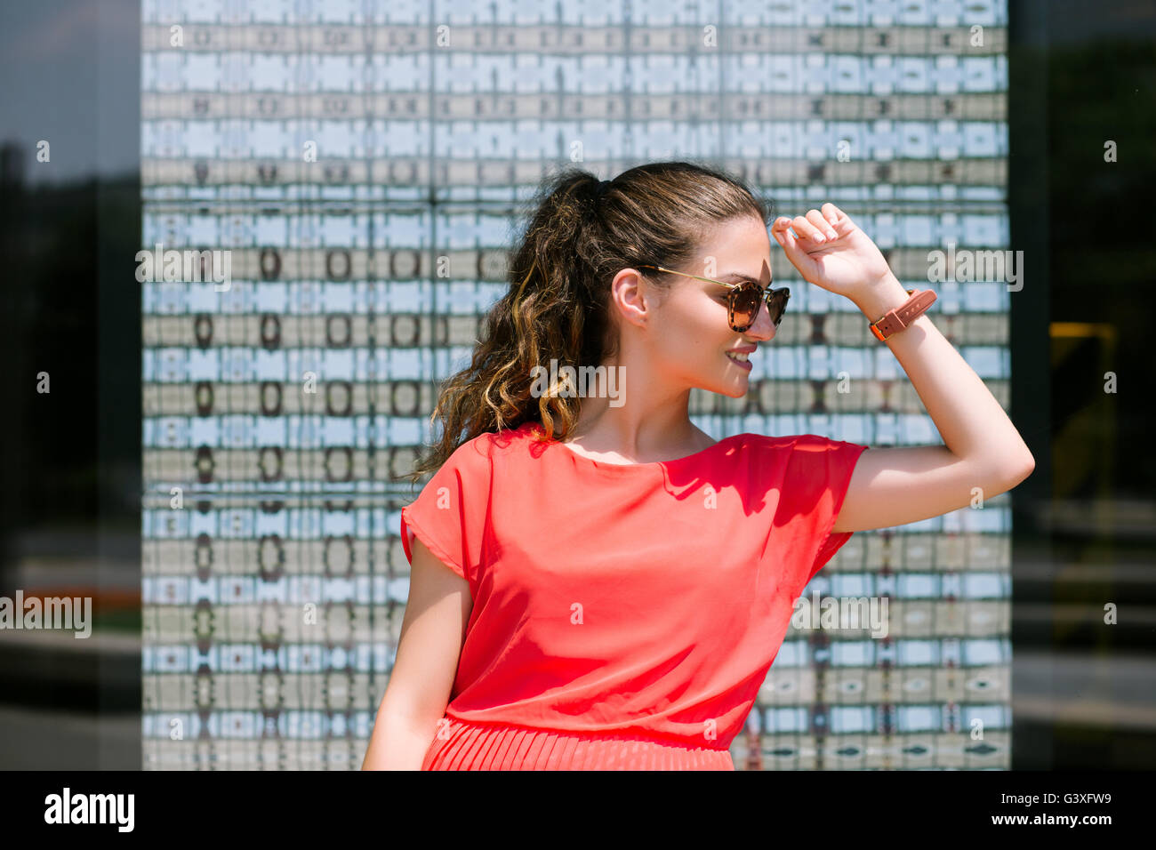 Portrait of a young woman with sunglasses Stock Photo - Alamy