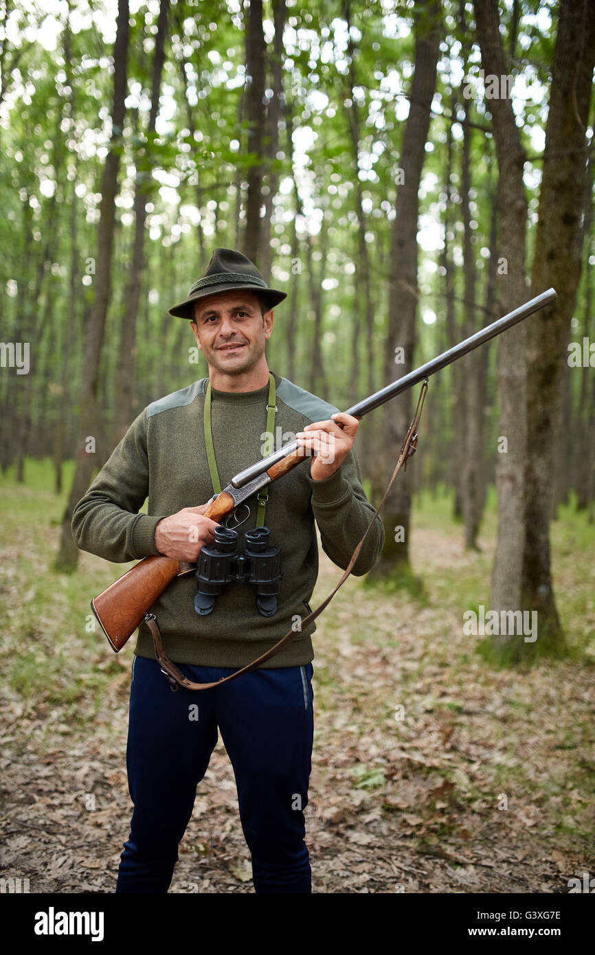 Hunter Dig Two Rifles Hunter with double barrel shotgun in the forest Stock Photo - Alamy