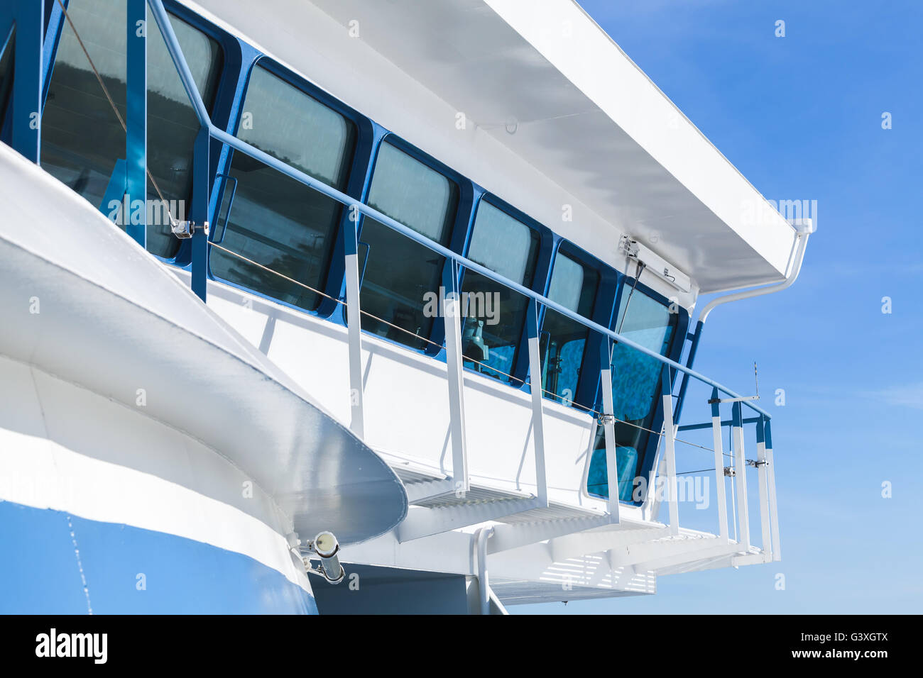 Modern passenger ferry ship. Captains bridge exterior over clear blue sky Stock Photo