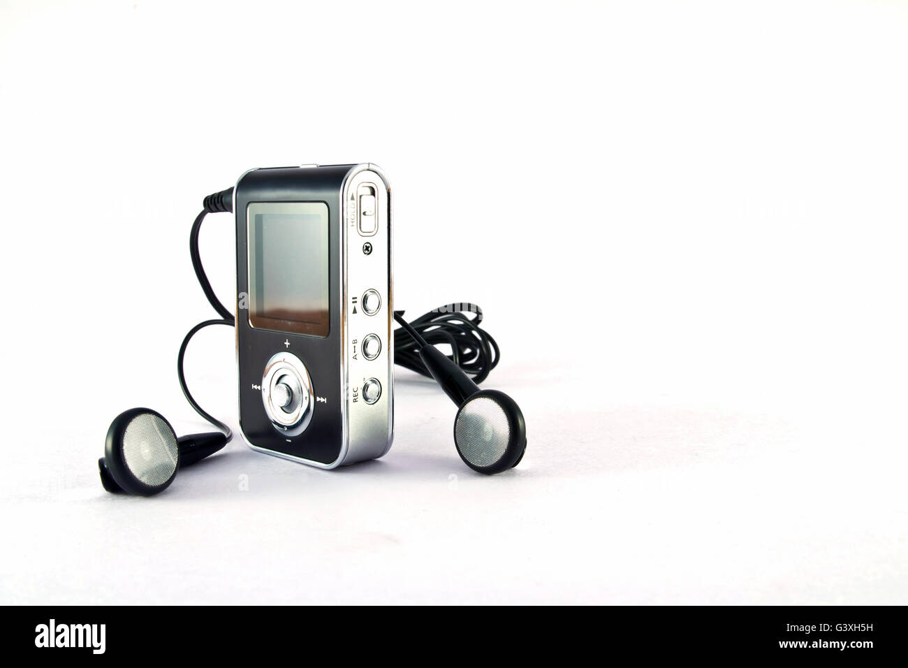 mp3 player and headphones isolated on white background Stock Photo - Alamy