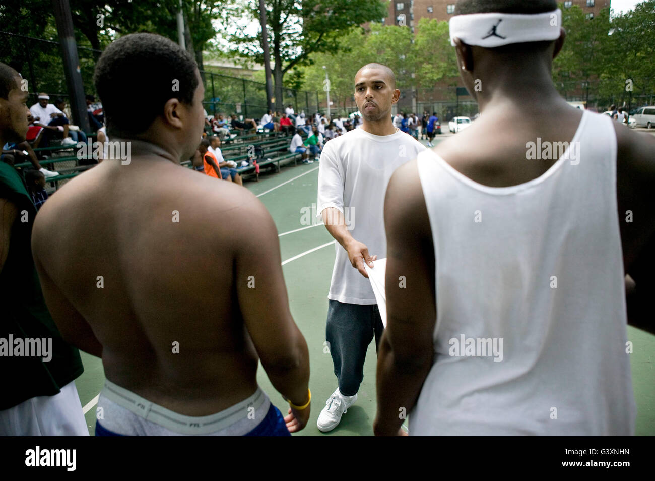A member of the organizing team picks teams during the Ruckers street basketball tournament tryouts, at Ruckers Park in Harlem, Stock Photo