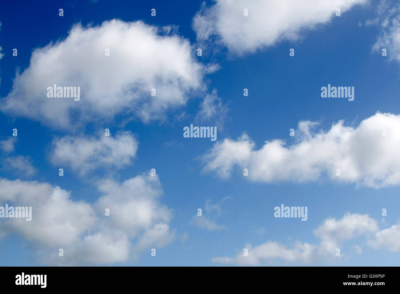 Fluffy white clouds in sky Stock Photo