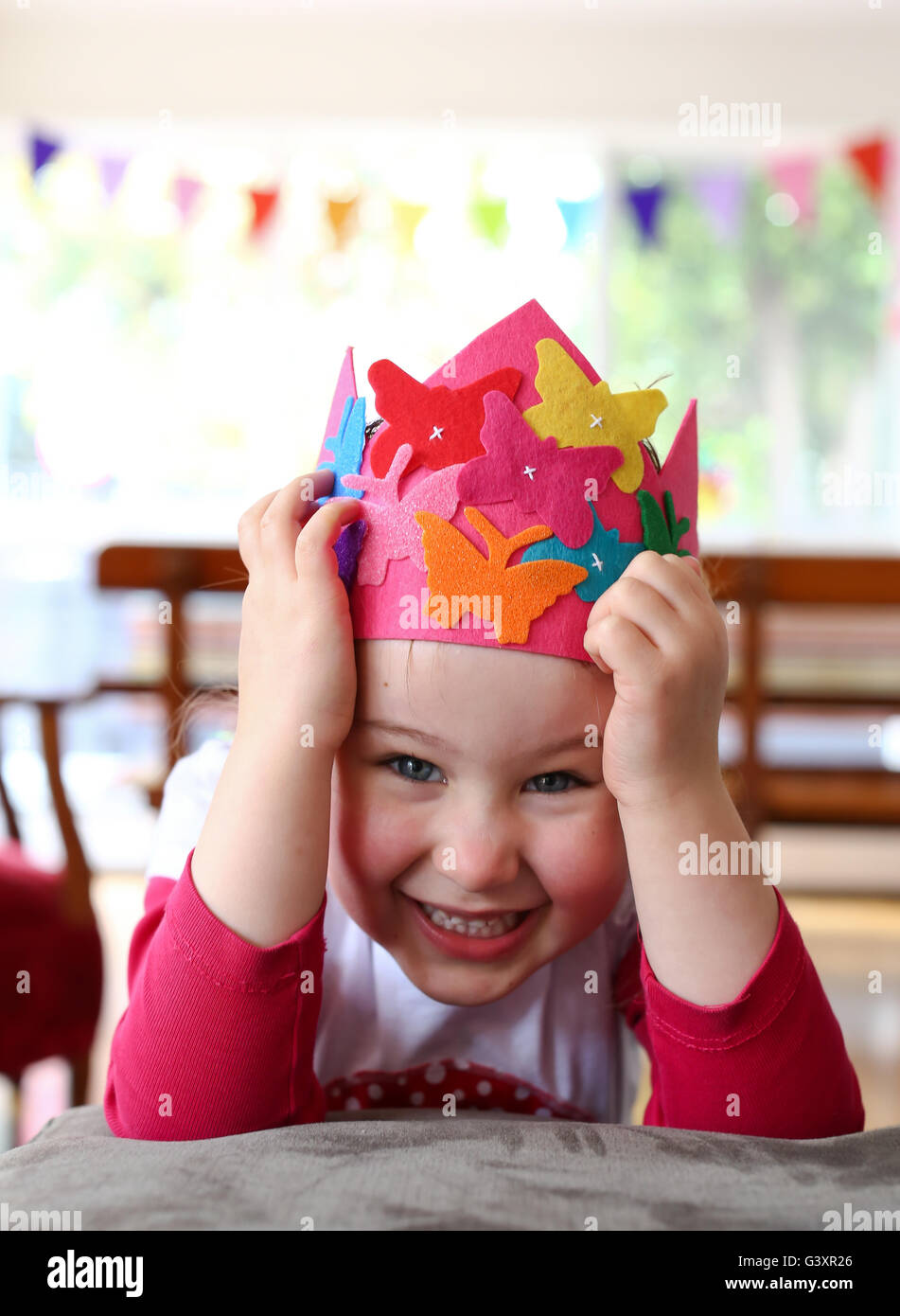 Child with party hat being silly Stock Photo