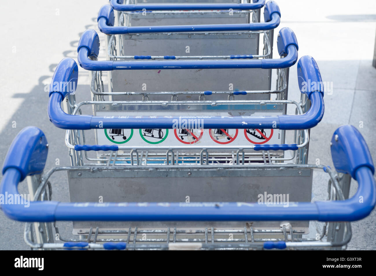 luggage carts outside airport Stock Photo Alamy