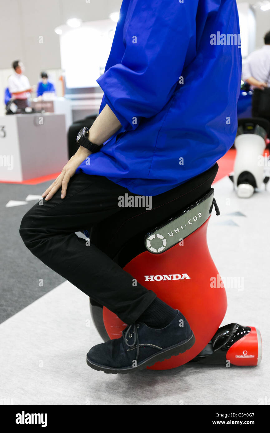 Tokyo, Japan. 16th June, 2016. An exhibitor drives a personal device ''UNI-CUB'' at the Smart Community Japan 2016 show at Tokyo Big Sight on June 16, 2016, Tokyo, Japan. Smart Community Japan promotes the latest technology related to energy security and efficiency over three days at Tokyo Big Sight. This year 296 enterprises and organizations are showing their products. Organisers reported 12,391 visitors on June 15th, the first day of the show. Credit:  Rodrigo Reyes Marin/AFLO/Alamy Live News Stock Photo