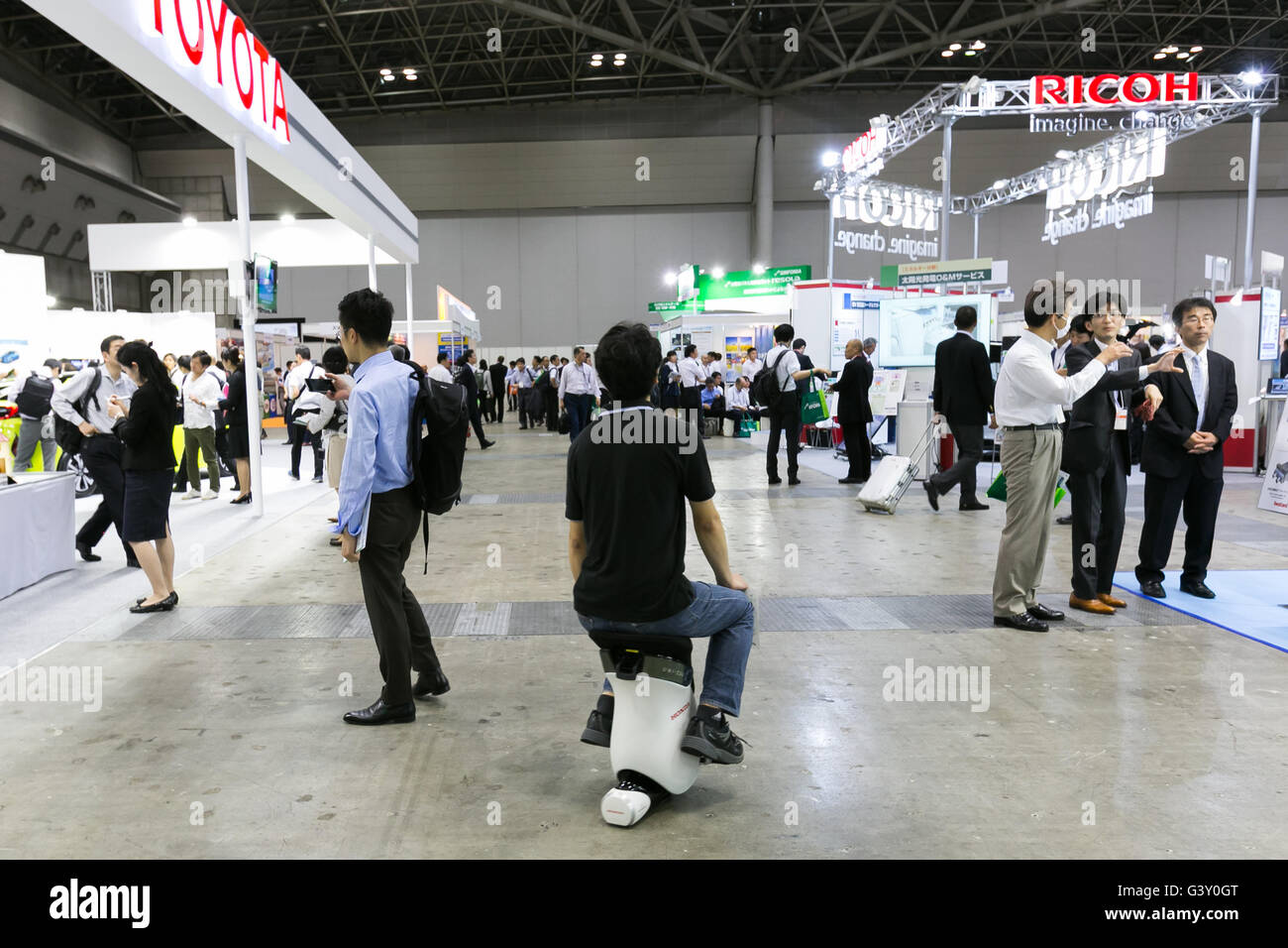 Tokyo, Japan. 16th June, 2016. An exhibitor drives a personal device ''UNI-CUB'' at the Smart Community Japan 2016 show at Tokyo Big Sight on June 16, 2016, Tokyo, Japan. Smart Community Japan promotes the latest technology related to energy security and efficiency over three days at Tokyo Big Sight. This year 296 enterprises and organizations are showing their products. Organisers reported 12,391 visitors on June 15th, the first day of the show. Credit:  Rodrigo Reyes Marin/AFLO/Alamy Live News Stock Photo