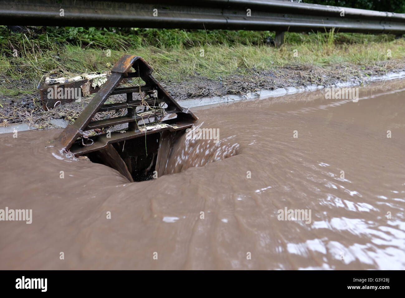 flood water going down a drain Stock Photo Alamy