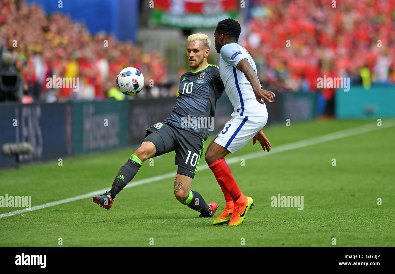 Lens, France. 16th June, 2016. Aaron Ramsey of Wales is tackled by Danny Rose of England in the second half at the Stade Bollaert-Delelis in Lens, France this afternoon during their Euro 2016 Group B fixture. Credit:  Phil Rees/Alamy Live News Stock Photo