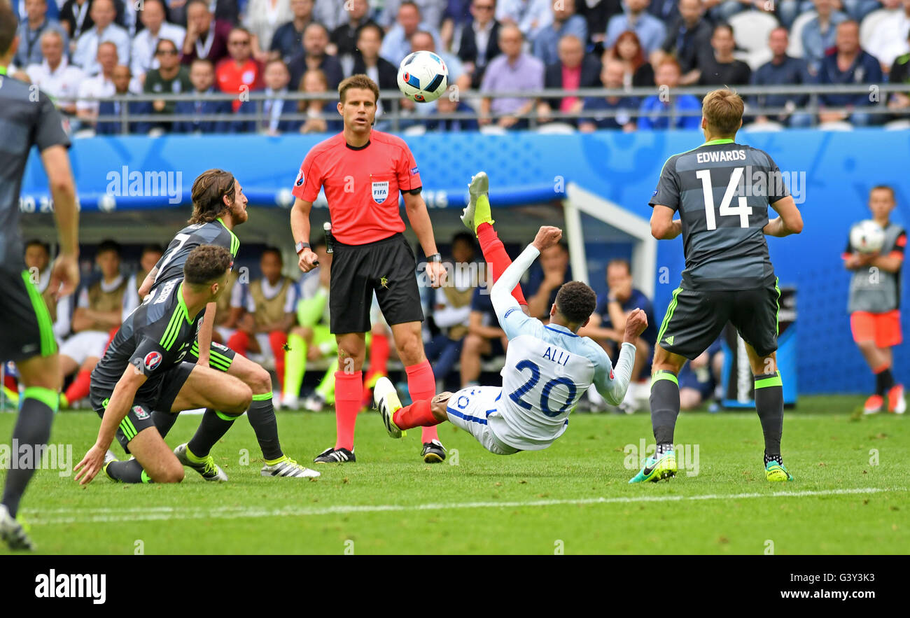 Lens, France. 16th June, 2016. Dele Alli of England tries an overhead