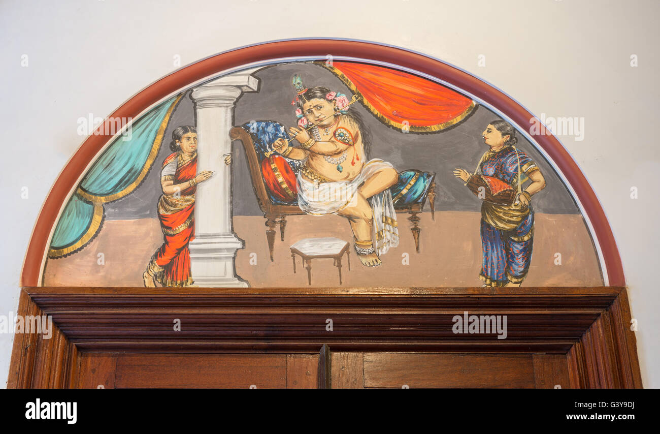 Chidambara Palace, Krishna plays flute while woman Tabla Stock Photo