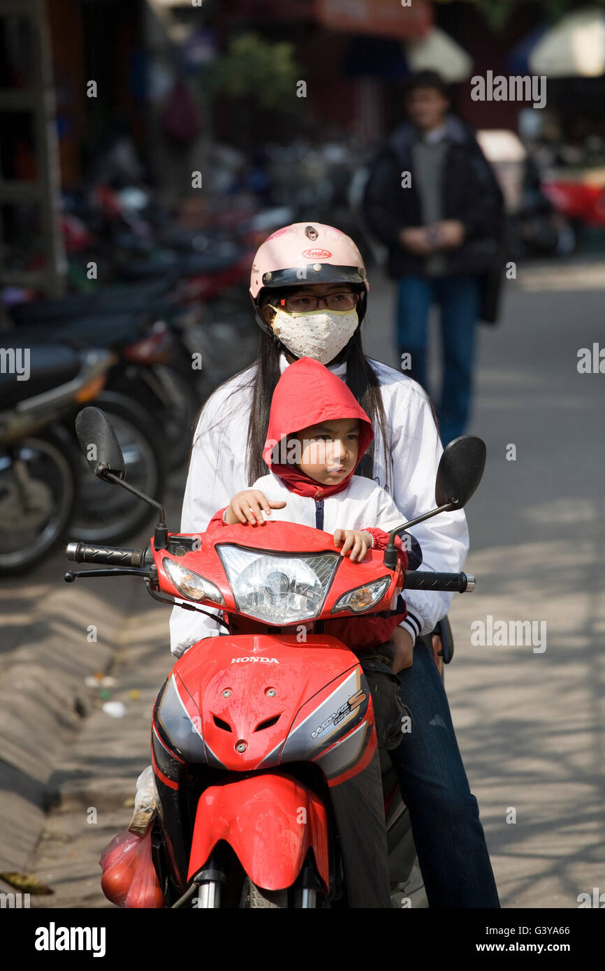 Child on moped asia hires stock photography and images Alamy