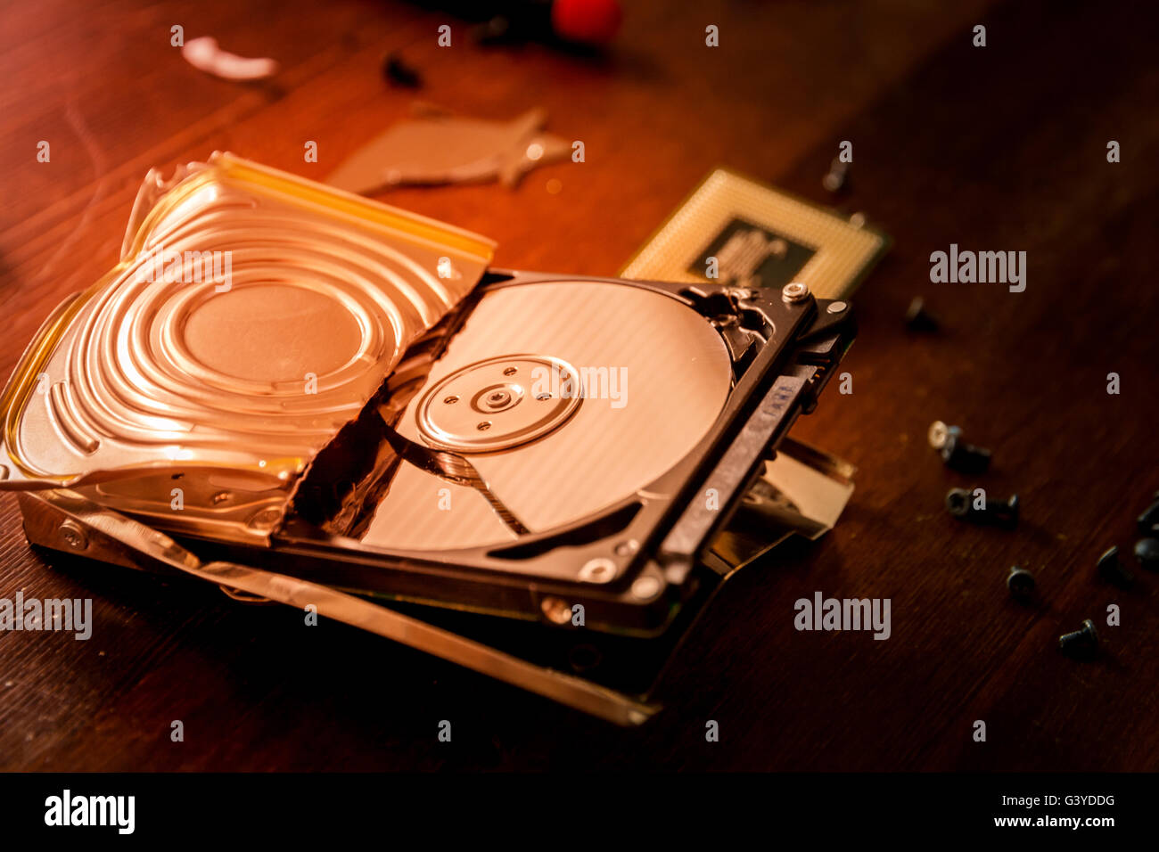 Broken and open computer or laptop hard drive Stock Photo