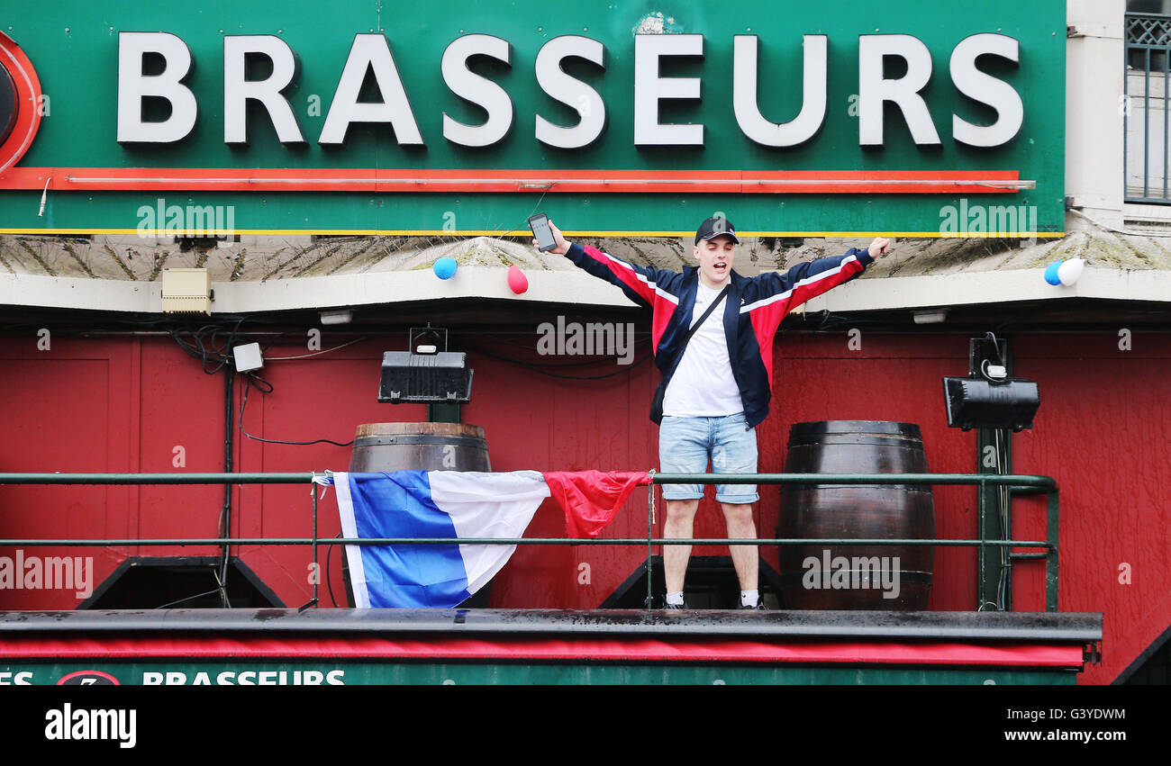 A football fan on the balcony of Brasseurs restaurant in Lille, ahead of England's Euro 2016 clash with Wales. Stock Photo