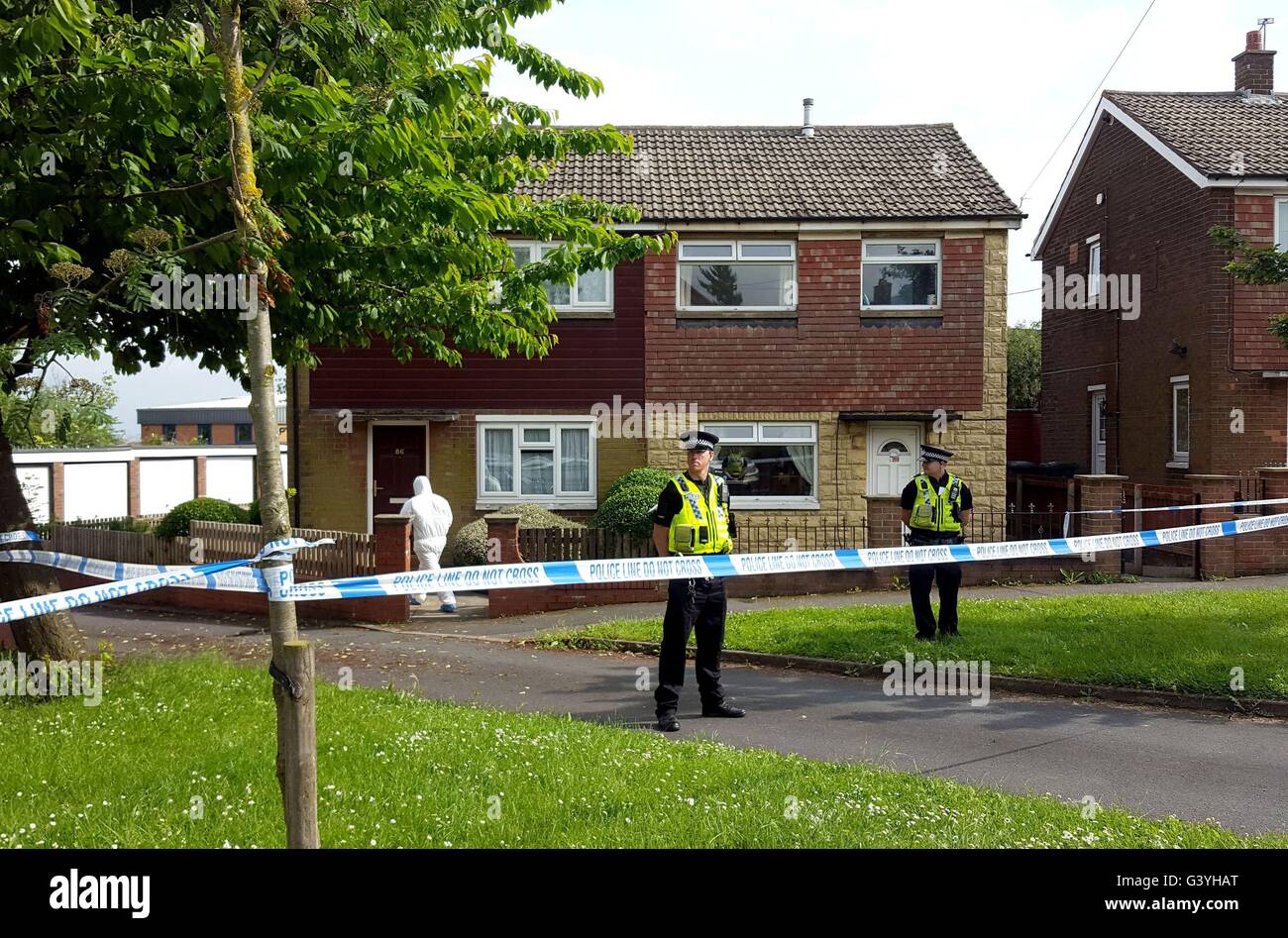 Police guard the house in Lowood Lane where Tommy Mair, the suspect