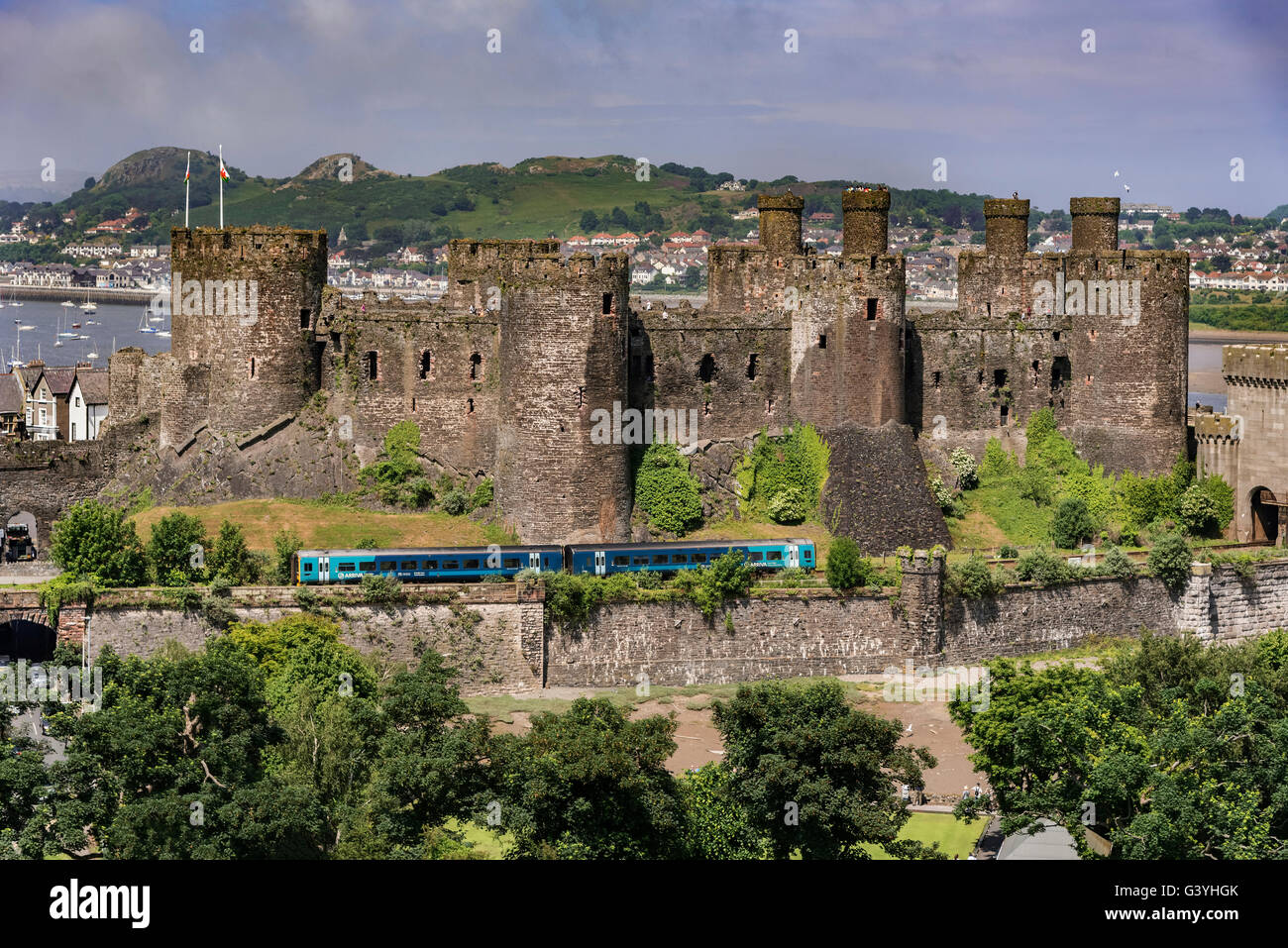 Conwy Castle Clwyd North Wales on the river Conwy. Conway Arriva train. Arriva train. Stock Photo