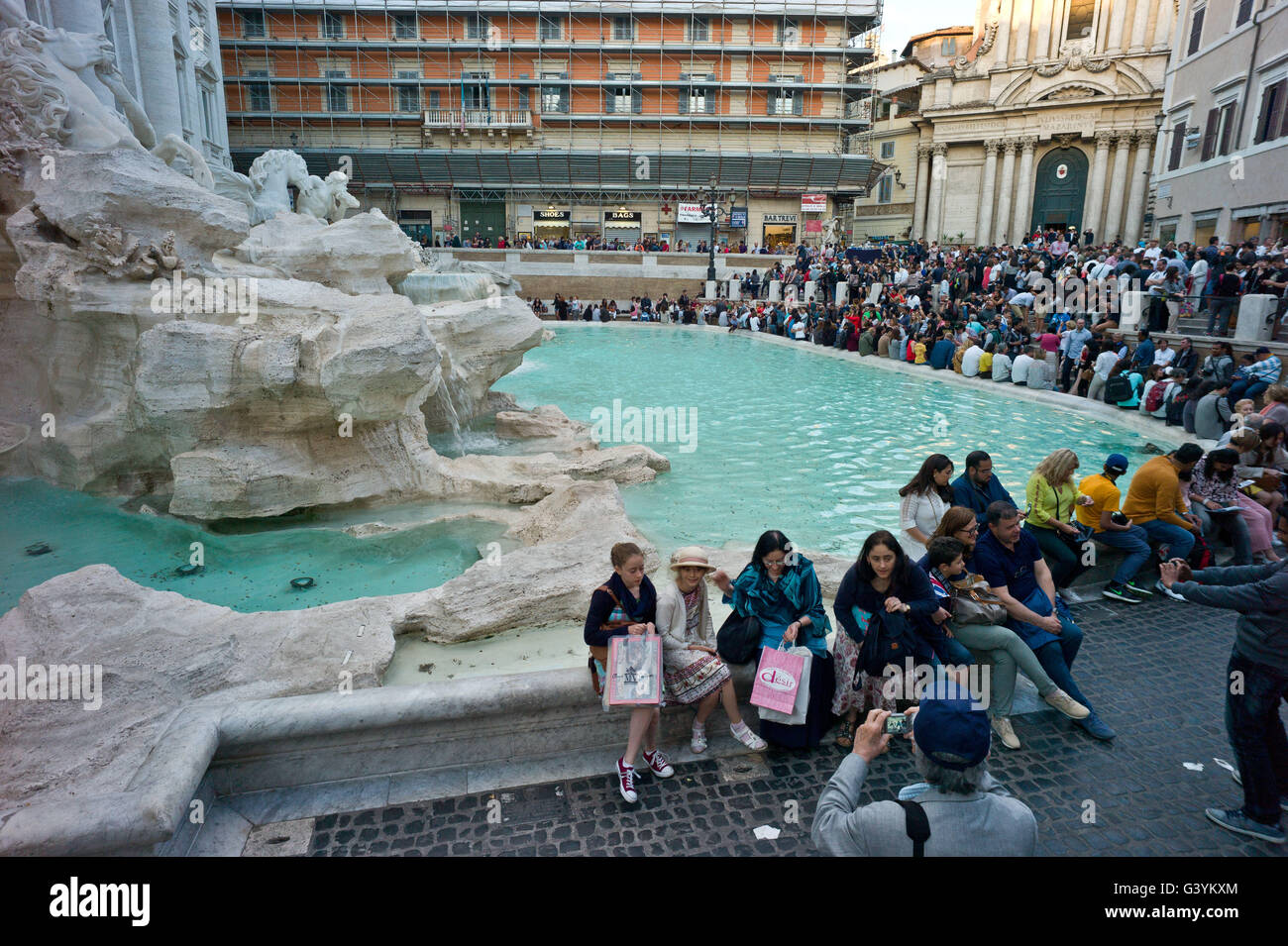 Tourists at Trevi Fountain in Rome made famous by the film La Dolce Vita Stock Photo