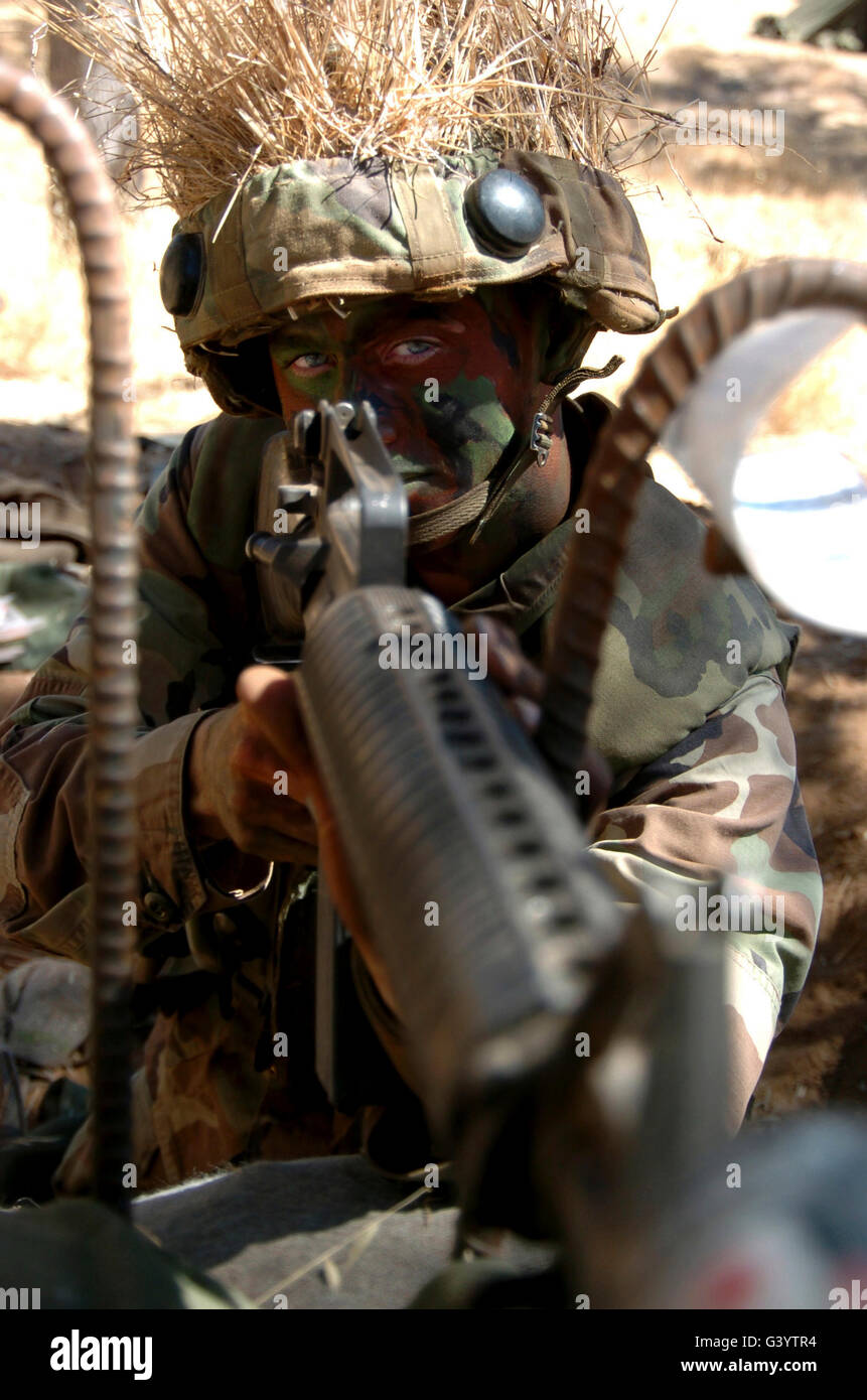 Soldier mans a defensive firing position. Stock Photo