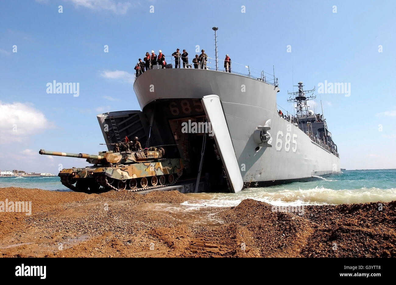 A Republic of Korea Type 88 K1 Main Battle Tank drives off the Korean Amphibious Ship Sungoonbang  onto Pohang Beach. Stock Photo