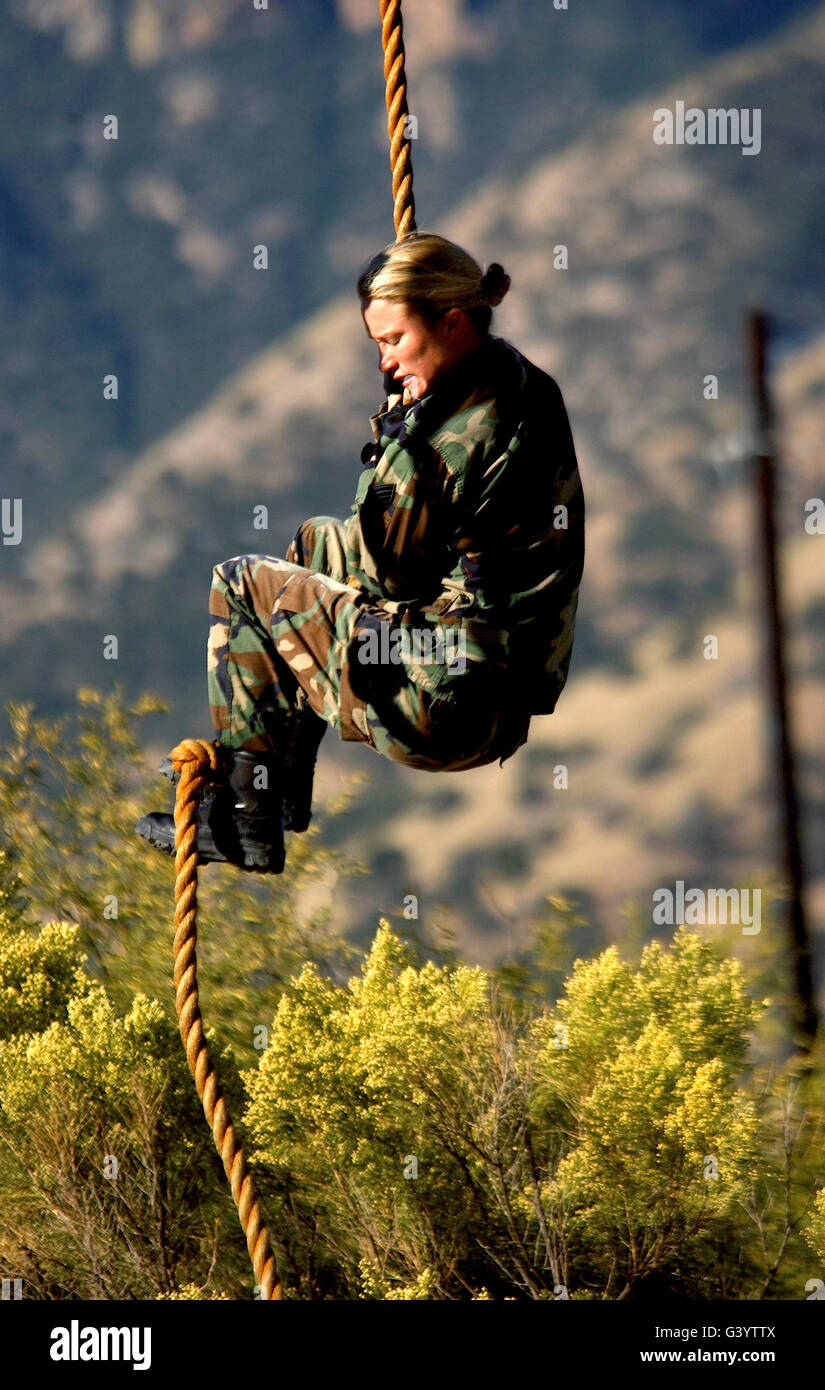 Premium Photo  Military soldiers climbing rope during obstacle course