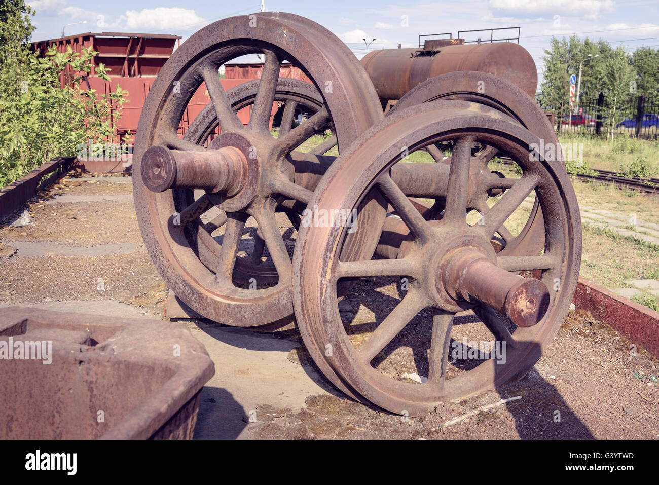 Old railcar wheelset. Old industrial railway cars on on Mining and metallurgical plant Stock Photo