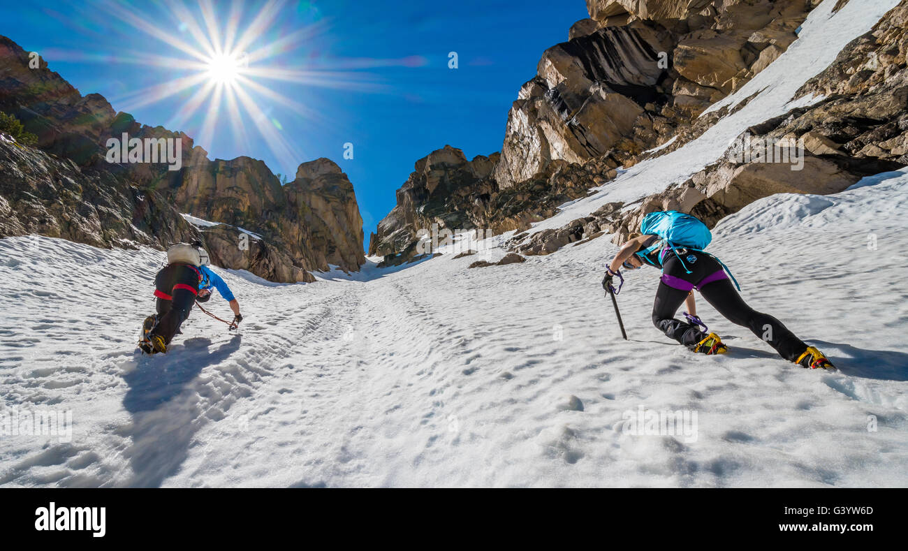 Brandon Prince and Noelle Synder climbing Mount Heyburn in the Sawtooth Mountain Range Stock Photo