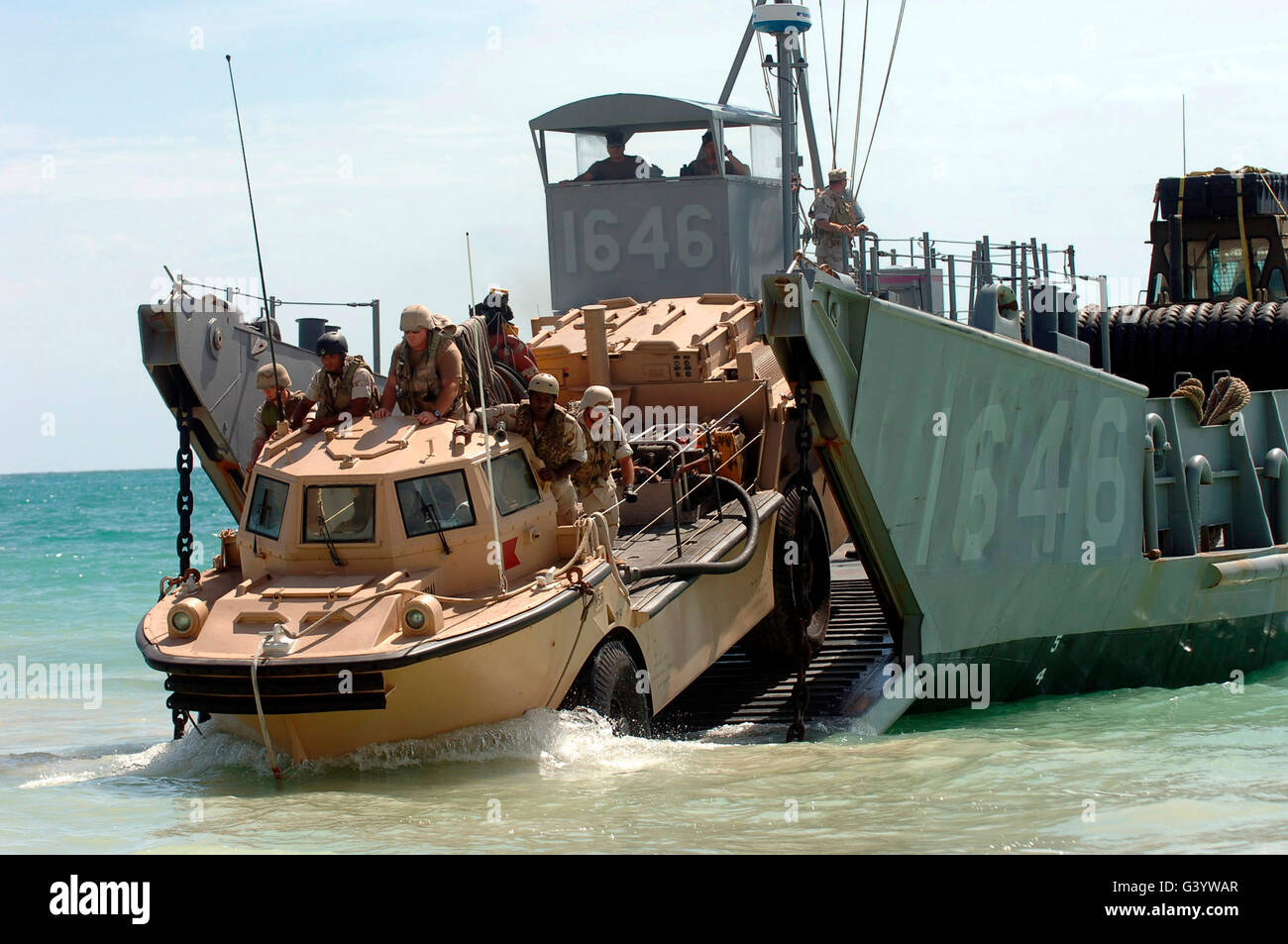 A Logistical Amphibious Recovery Craft disembarks from a Landing Craft Utility. Stock Photo