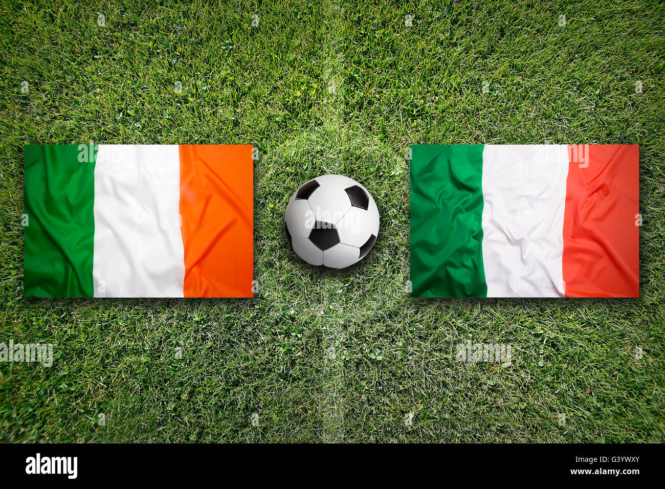 Ireland vs. Italy flags on green soccer field Stock Photo Alamy