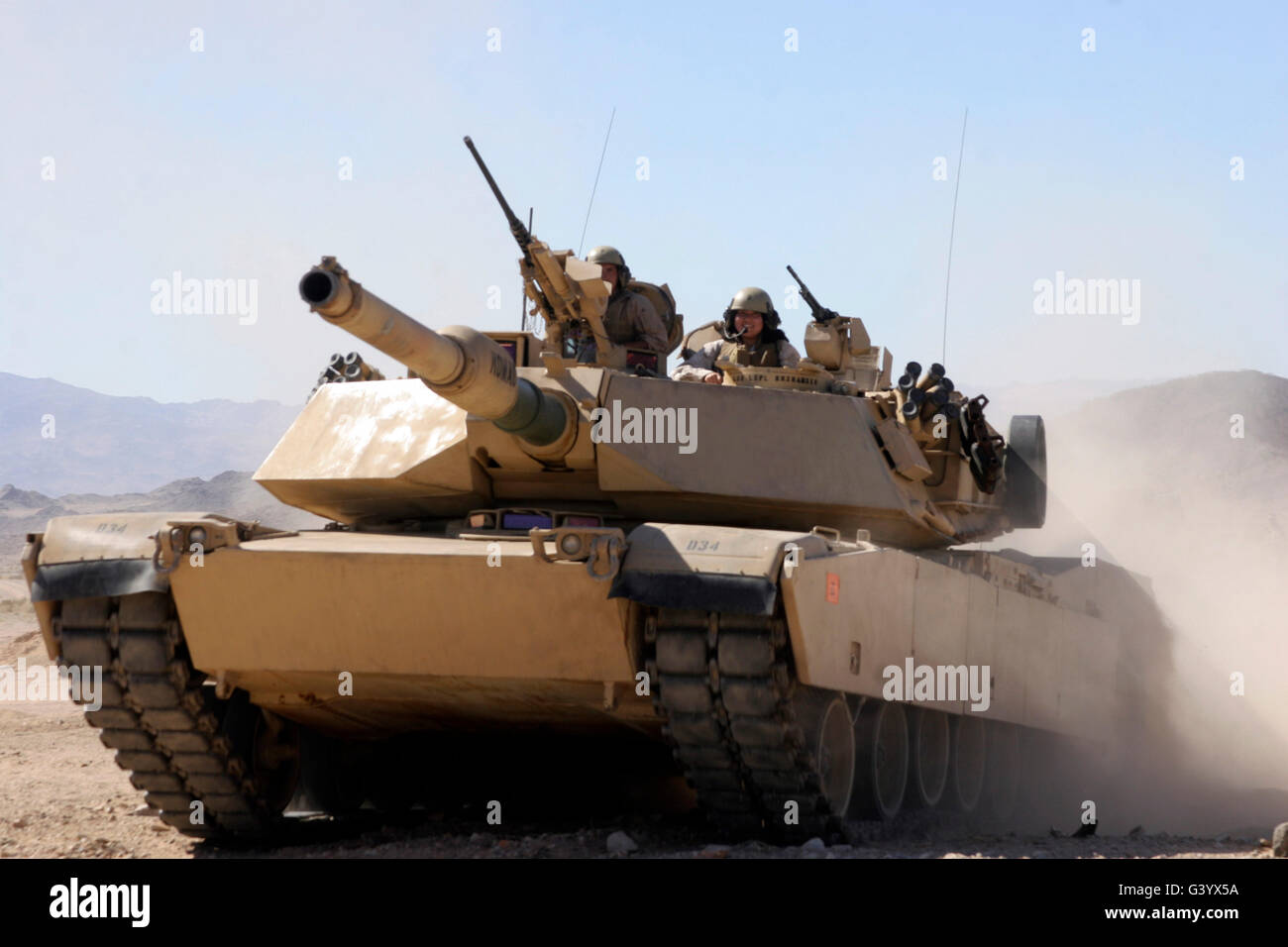 A kid enjoys a cruise in an M1A1 Abrams Tank. Stock Photo