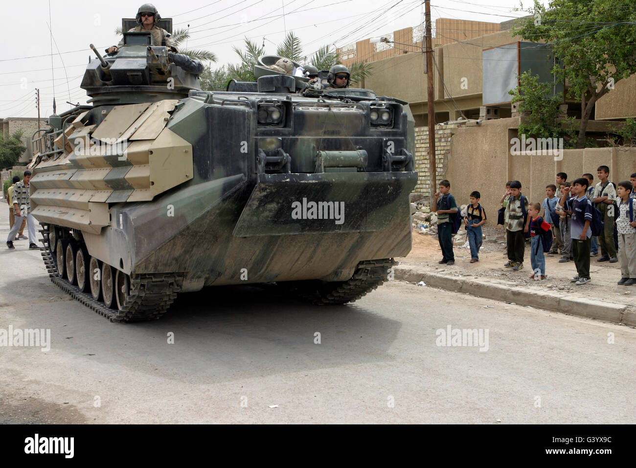 An Amphibious Assault Vehicle rolls down the city streets while patrolling. Stock Photo
