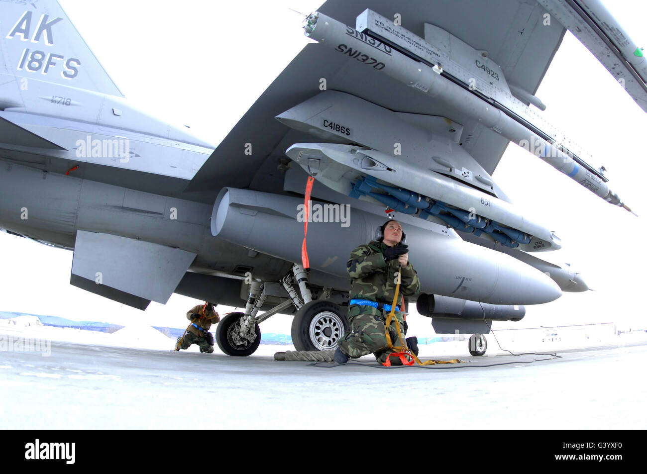 U.S. Air Force Airmen prep an F-16C Fighting Falcon aircraft. Stock Photo