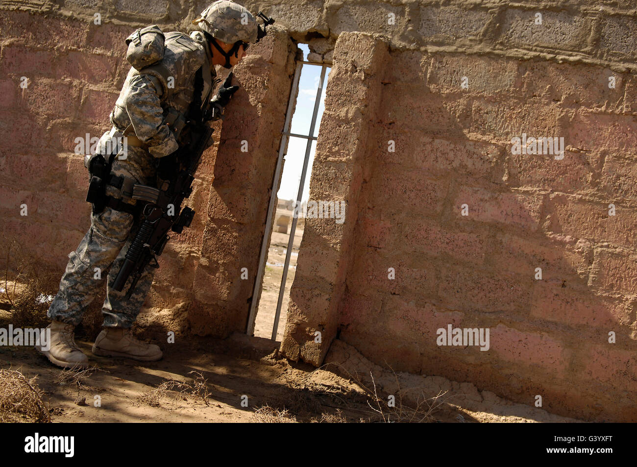 U.S. Army Sergeant looks for a sniper. Stock Photo