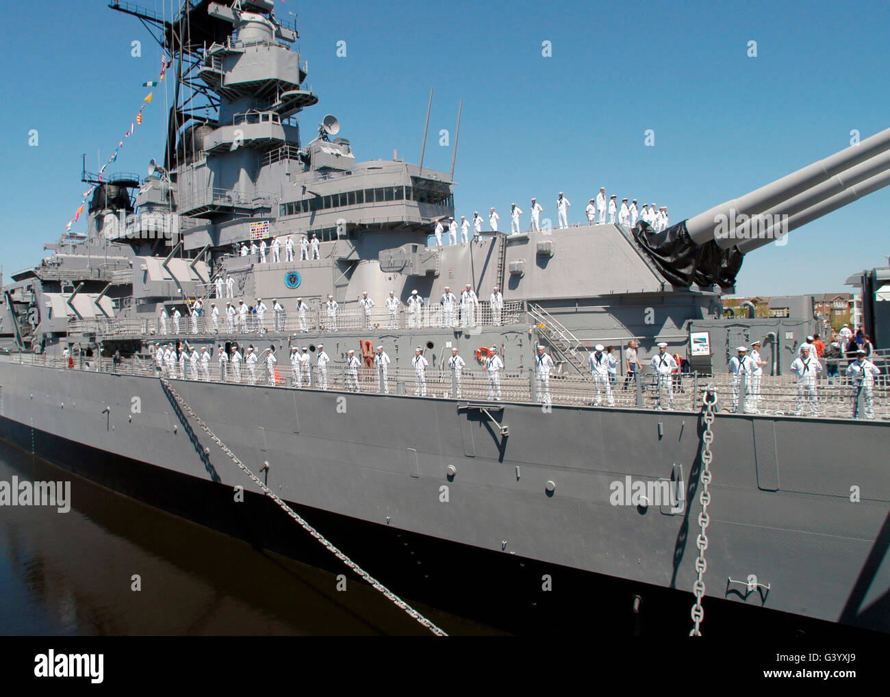 Sailors man the rails on the decommissioned U.S. Navy Battleship, USS Wisconsin. Stock Photo