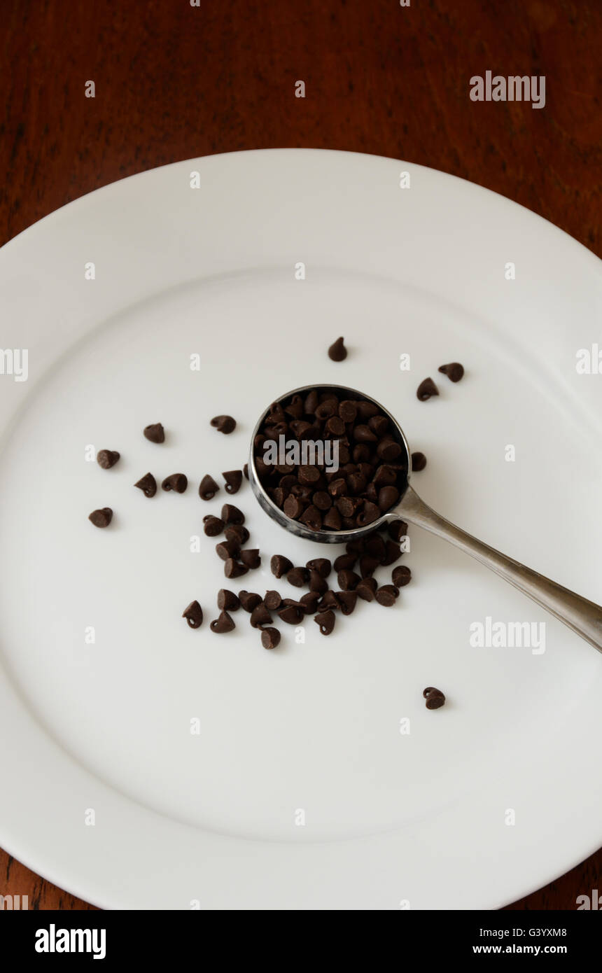 Tablespoon of mini chocolate chips Stock Photo Alamy