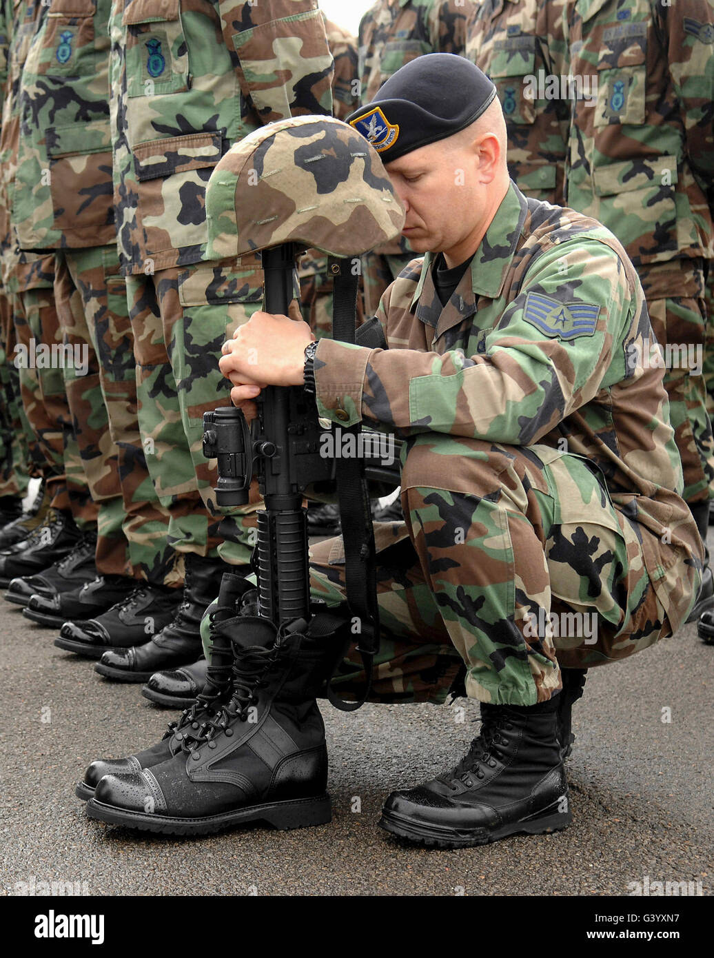 Soldier pays his respects during a Final Guard Mount ceremony. Stock Photo